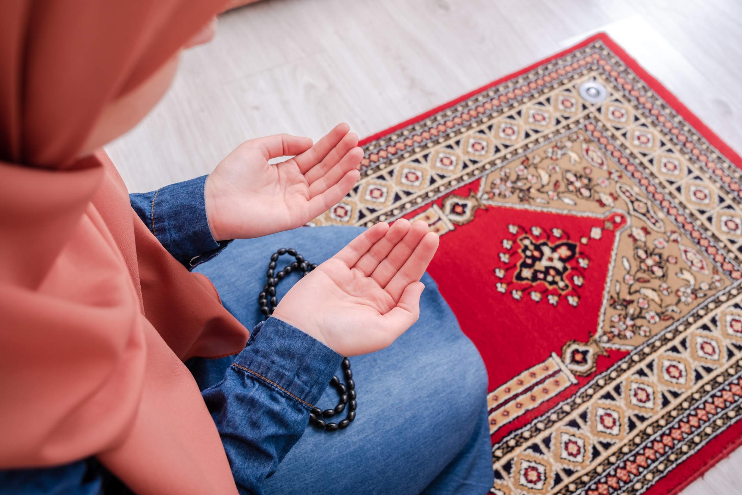 Picture of young Muslim praying for opinion on prayer ban at Michaela school